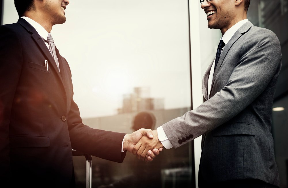 Handshake symbolising a CSR partnership with Sunil Foundation